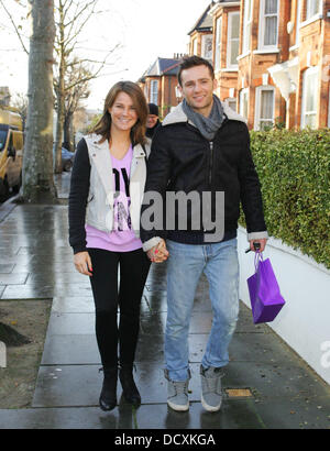 Harry Judd and girlfriend Izzy Johnston  leaving Fearne Cotton's house after her Christmas Party London, England - 22.12.11 Stock Photo