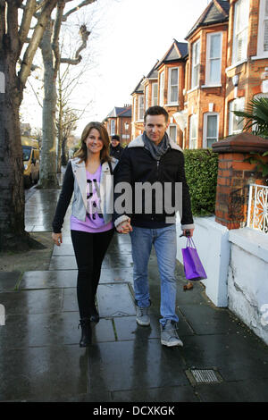 Harry Judd and girlfriend Izzy Johnston  leaving Fearne Cotton's house after her Christmas Party London, England - 22.12.11 Stock Photo