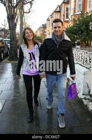 Harry Judd and girlfriend Izzy Johnston  leaving Fearne Cotton's house after her Christmas Party London, England - 22.12.11 Stock Photo