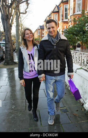 Harry Judd and girlfriend Izzy Johnston  leaving Fearne Cotton's house after her Christmas Party London, England - 22.12.11 Stock Photo