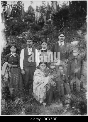 An Indian family, likely from a rural setting, depicted in this photograph, reflecting the cultural and social norms of the time. This image is part of a larger collection capturing the diversity of American life. Stock Photo