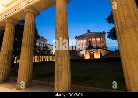 Evening view of Alte Nationalgalerie on right and Neues Museum on Museumsinsel or Museum Island in Berlin Germany Stock Photo