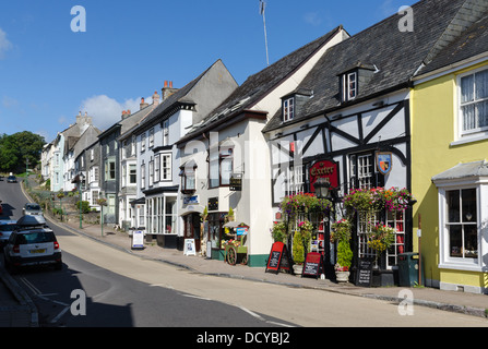 Shops and houses and the Exeter Inn public house on Church Street, Modbury, Devon Stock Photo