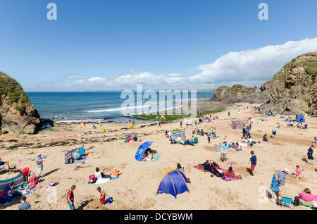 Holidaymakers on Mouthwell Beach at Hope Cove in Devon Stock Photo
