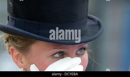 Herning, Denmark, Germany. 22nd Aug, 2013. German dressage rider Helen Langehanenberg is happy after her run of the team competition of the FEI European Championships in Herning, Denmark, Germany, 22 August 2013. The German team finished first. Photo: Jochen Luebke/dpa/Alamy Live News Stock Photo