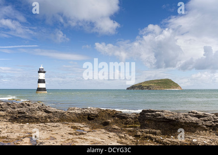 Lighthouse and Puffin Island at Penmon Point, Anglesey, North Wales Stock Photo