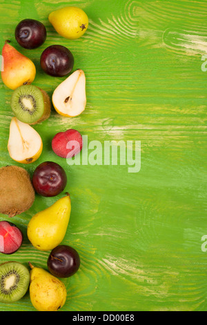 Fresh fruit arranged on a rustic background Stock Photo