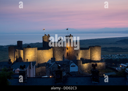 Harlech Castle at night / sunset / twilight / dusk looking out to sea to Llŷn Peninsula Gwynedd North Wales UK Stock Photo