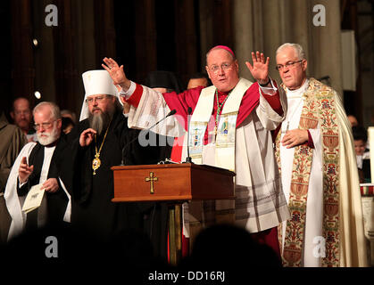 Cardinal Designate Timothy M Dolan, Archbishop of New York (C) during a prayer for Christian Unity on January 18, 2012 at St Patricks Cathedral in New York City, USA - 18.01.12 Stock Photo