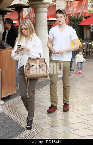 Lucas Till and his girlfriend walk through The Grove West Hollywood, California - 19.01.12 Stock Photo