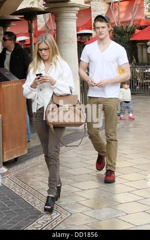 Lucas Till and his girlfriend walk through The Grove West Hollywood, California - 19.01.12 Stock Photo