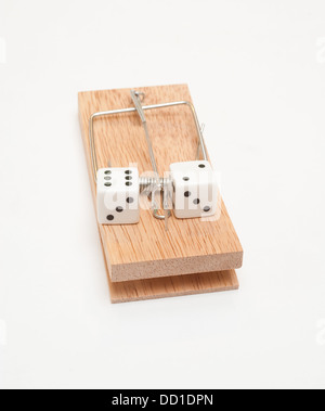 A pair of dice on a mousetrap Stock Photo
