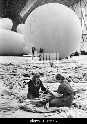 The image from the Nazi Propaganda! shows women producing barrage balloons in a production facility of the defense industry, published 6 April 1943. Fotoarchiv für Zeitgeschichte Stock Photo