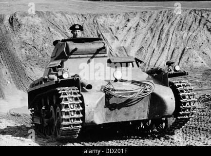 Tank of the German Wehrmacht during a maneuver on military training ground in June 1938. The Nazi Propaganda! on the back of the picture is dated 21 June 1938: 'Tanks in the field! A picture report of the maneuver of a motor vehicle combat troop. - Our image shows: Downhill and then further through even grounds.' Fotoarchiv für Zeitgeschichte Stock Photo