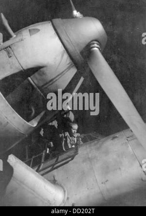 The image from the Nazi Propaganda! shows a pilot boarding his aircraft shortly before a night operation in October 1944, place unknown. Fotoarchiv für Zeitgeschichte Stock Photo