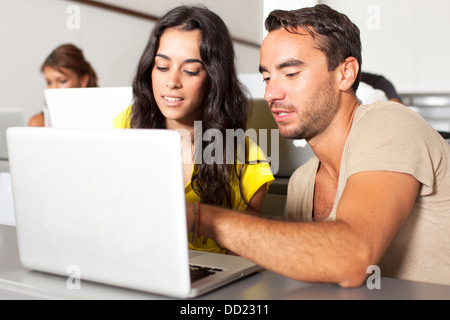 Two students talking in the classroom Stock Photo
