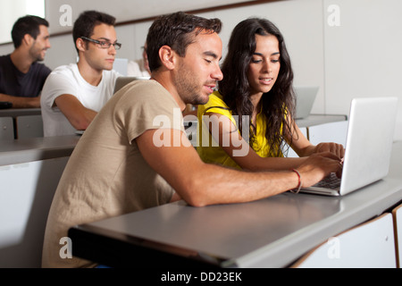 Two students working on laptop Stock Photo