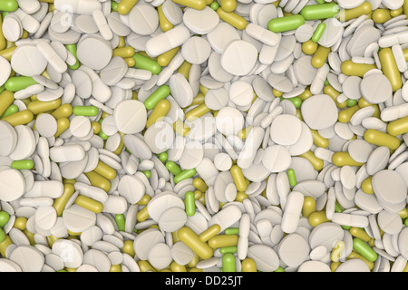 close-up view of many different pills and tablets in green, yellow and white Stock Photo