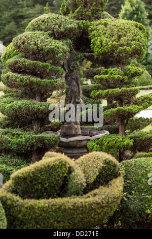 Pearl Fryar without any horticultural experience turned discarded plants into an amazing topiary wonderland in his former corn field in a tiny village in rural South Carolina. Stock Photo