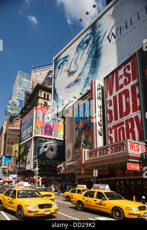 2009 HISTORICAL YELLOW TAXIS (©FORD MOTOR CO 2000) PRINTED PAPER BILLBOARDS TIMES SQUARE MANHATTAN NEW YORK USA Stock Photo