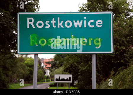 Bilingual Polish - German city sign, Rostkowice, Opole, Silesia, Poland Stock Photo