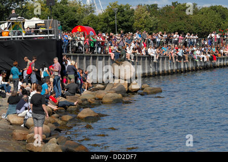 Copenhagen, Denmark, August 23, 2013. The Little Mermaid turns 100 today and Copenhagen throws her a party to celebrate her centenary with thousands of visitors in a day-long versatile programme honouring the Hans Christian Andersen figure and icon. Credit:  Niels Quist/Alamy Live News Stock Photo