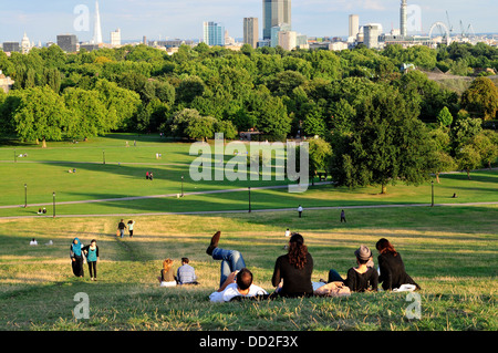 People relax in Primrose Hill, London, UK Stock Photo