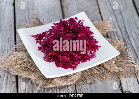 Portion of Red Coleslaw on vintage wooden background Stock Photo