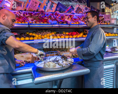 Paris, France, Two People, Men, Working, Fish Mongers at French Bistro Restaurant 'Dorr Restaurant' in Latin Quarter, Preparing Oysters france fish platter restaurant workers Stock Photo