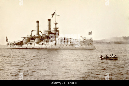 US Navy sailors man the rails aboard the battleship USS Iowa, the first named for the state in an undated photo off the coast of Washington State. The USS Iowa was launched in 1896 but became obsolete quickly due to rapid advancement in naval ship designs and was used for target practice and sunk in 1923. Stock Photo