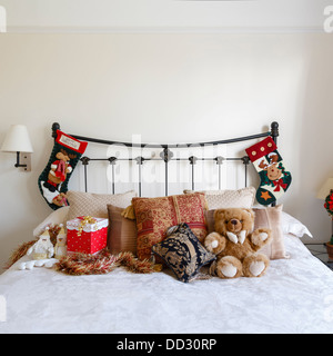 Cozy bedroom with Christmas decorations and stockings Stock Photo