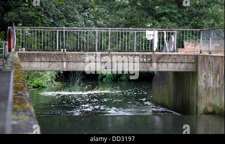 Biggleswade, Bedfordshire, UK. 24th August 2013. The body of a 15-year-old boy has been recovered from a river in Biggleswade.  The body, believed to be that of a boy who went missing while swimming on Friday, was retrieved from the River Ivel, near the weir at Mill Lane, Biggleswade.    Specially trained fire fighters in dry suits entered the water using rescue sleds and tethered lines to search the waters of the River Ivel into the night, but unfortunately were unable to locate the youth. Credit:  KEITH MAYHEW/Alamy Live News Stock Photo