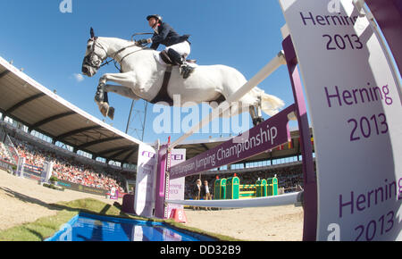 Herning, Denmark. 24th Aug, 2013. British show jumper Ben Maher jumps over an obstacle on his horse Cella in the first round of the single final event at the FEI European Championships in jumping and dressage in Herning, Denmark, 24 August 2013. Photo: Jochen Luebke/dpa/Alamy Live News Stock Photo