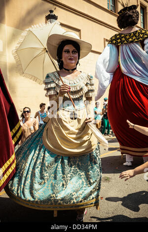 Sitges, Spain. August 24th, 2013: Costumed figures known as 'gegants' dance in the streets of Sitges during the Festa Major Credit:  matthi/Alamy Live News Stock Photo