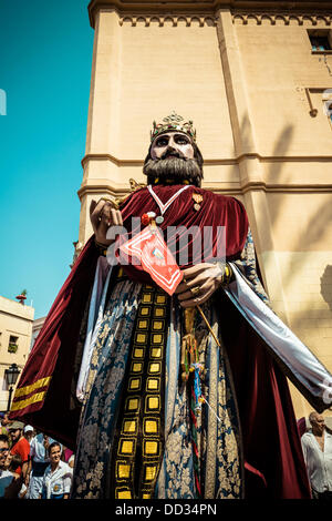 Sitges, Spain. August 24th, 2013: The giant of Sitges, a costumed figure known as 'gegants', dances in the streets of Sitges during the Festa Major Credit:  matthi/Alamy Live News Stock Photo
