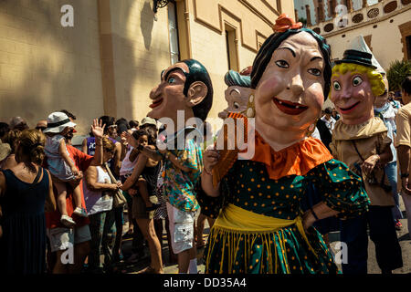 Sitges, Spain. August 24th, 2013: The big-heads of Sitges, costumed figures known as 'capgrossos', dances in the streets of Sitges during the Festa Major Credit:  matthi/Alamy Live News Stock Photo