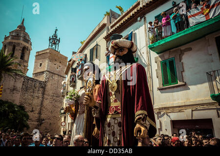 Sitges, Spain. August 24th, 2013: The giants of Sitges, costumed figures known as 'gegants', dance in the streets of Sitges during the Festa Major Credit:  matthi/Alamy Live News Stock Photo