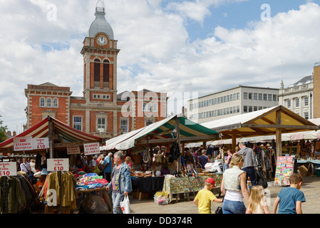 Shoppers visiting the outdoor market in Chesterfield town centre Stock Photo