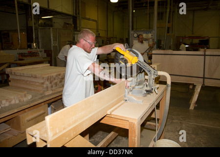 Inmate working in the woodshop at the Lincoln, Correctional Center, USA. Here hey make furniture and vairous other things. Stock Photo