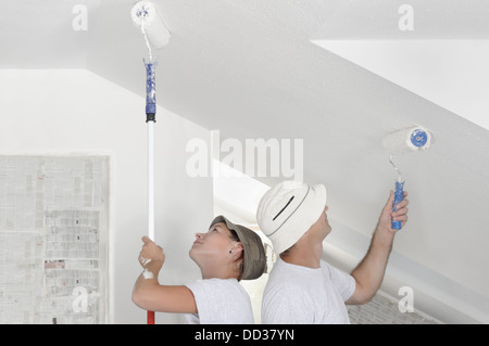 Painting wallpaper in apartment Stock Photo