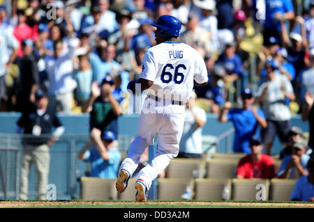 Los Angeles, CA, USA. 24th Aug, 2013. Los Angeles Dodgers right fielder Yasiel Puig #66 scores in the 8th inning during the Major League Baseball game between the Los Angeles Dodgers and the Boston Red Sox at Dodger Stadium.The Boston Red Sox defeat the Los Angeles Dodgers 4-2.Louis Lopez/CSM/Alamy Live News Stock Photo