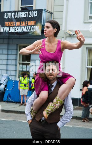 street performers eco dancers on the streets of Brecon during Brecon Jazz Festival 2013 Stock Photo