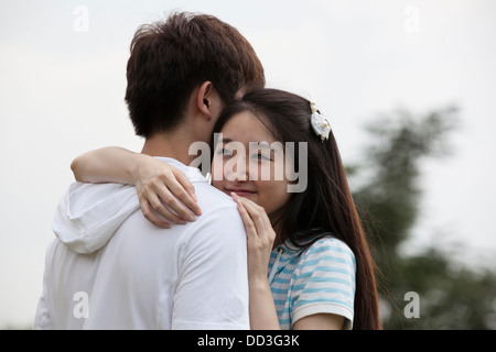 a young Asian couple is playing outdoor Stock Photo