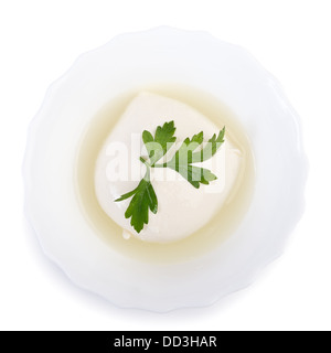 Fresh mozzarella cheese in bowl with whey isolated over white Stock Photo