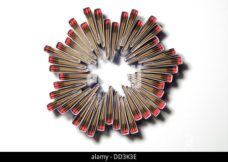 Packs of matches together forming a unique pattern. Circular shape, white background Stock Photo