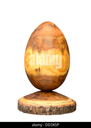 Egg made of acacia wood by means of wood turning, some bark was kept Stock Photo