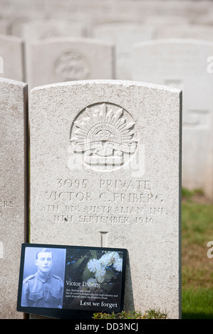 Picture of Australian WW1 soldier at grave at First World War One Lijssenthoek Military Cemetery, Poperinge, Flanders, Belgium Stock Photo