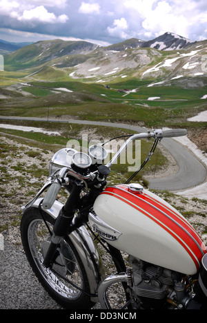 Triumph motorcycle above Campo Imperatore in the Gran Sasso, Abruzzo, Italy. Stock Photo