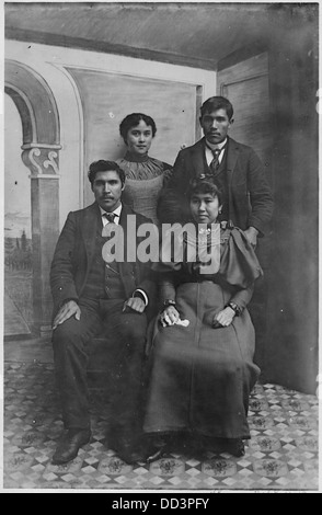 Two young Indian couples are depicted in this photograph, likely representing indigenous culture and traditions. Stock Photo