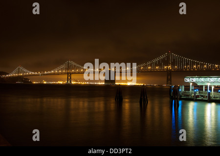 The stunning Bay Lights light sculpture on the Western span of the San Francisco-Oakland Bay Bridge as seen from Pier 1. Stock Photo
